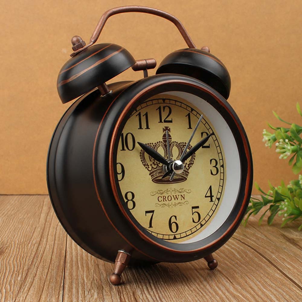 Reloj despertador vintage con corona de oro