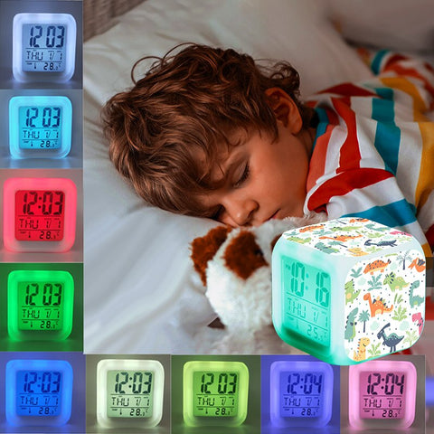 Delicado reloj despertador con forma de cubo luminoso de dinosaurio